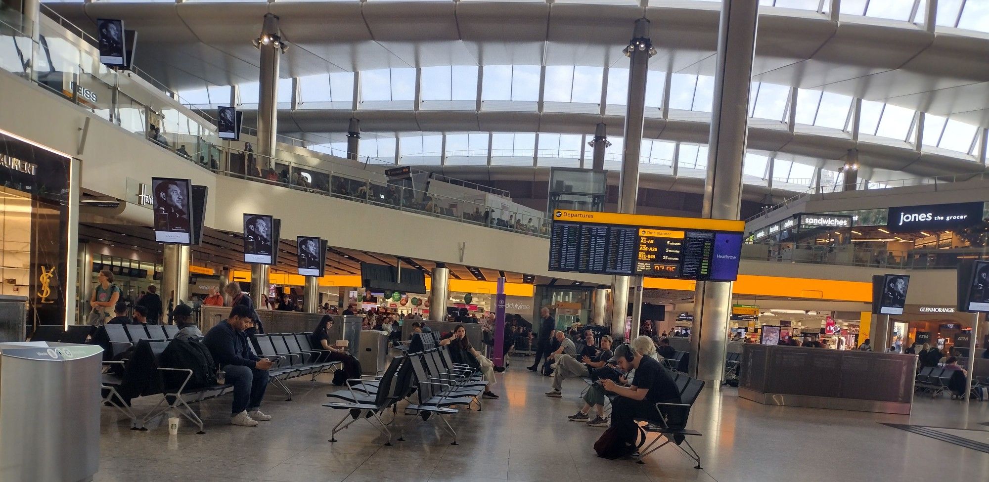 Seating area and duty-free shops in Heathrow Airport.
